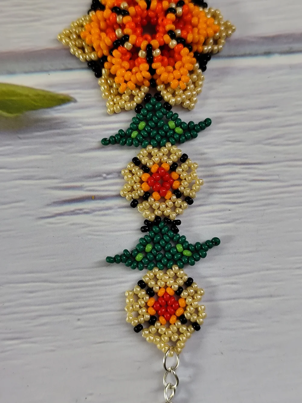 Vibrant Orange Floral Seed Bead Bracelet with Gold & Green Accents